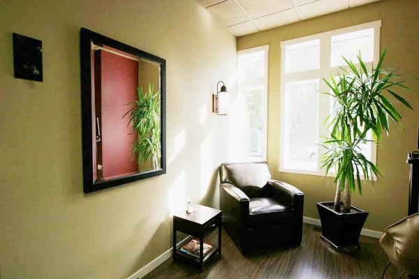 about-us-ambrosi-place man smiling in dentists chair