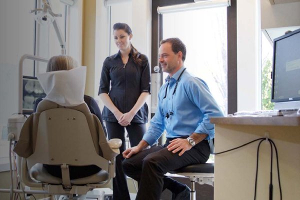 ambrosi-place-patient-centric-dental-care man smiling in dentists chair